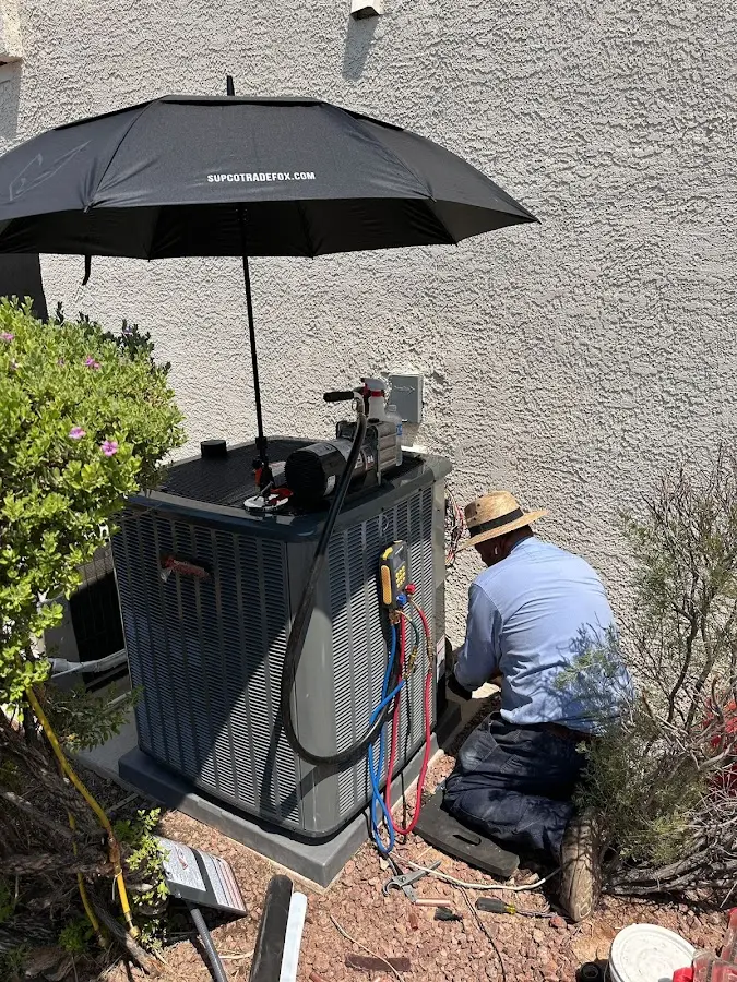 HVAC technician performing outdoor AC maintenance in Beltsville